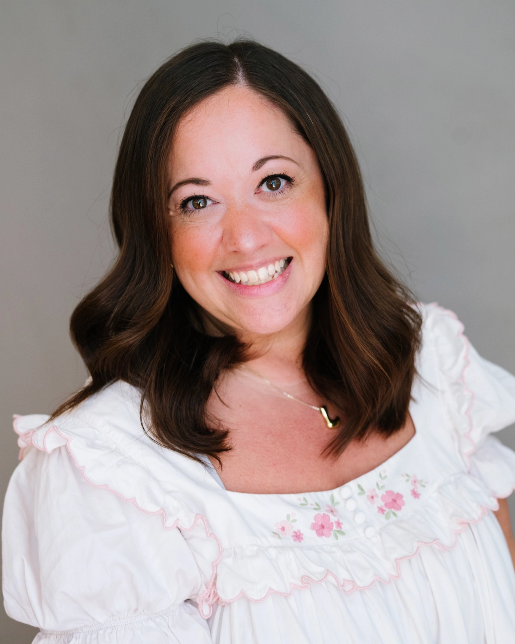 headshot of Laurie